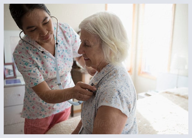 UF Health Proton Therapy Institute nurse assisting patient