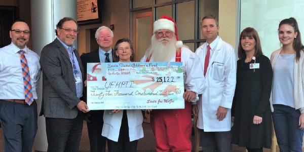 Santa Joe Delivers Donation for Children